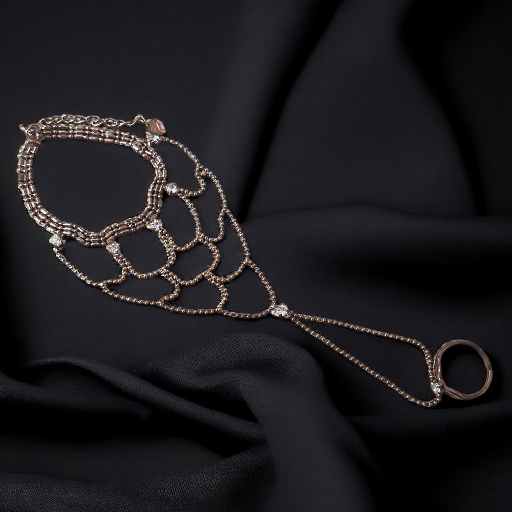 Copper tone woven hand/slave bracelet with ring